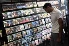 100427964-man-looking-at-video-games-store-getty.240x160